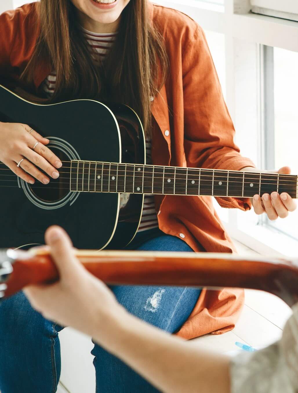 A guitar lesson taking place